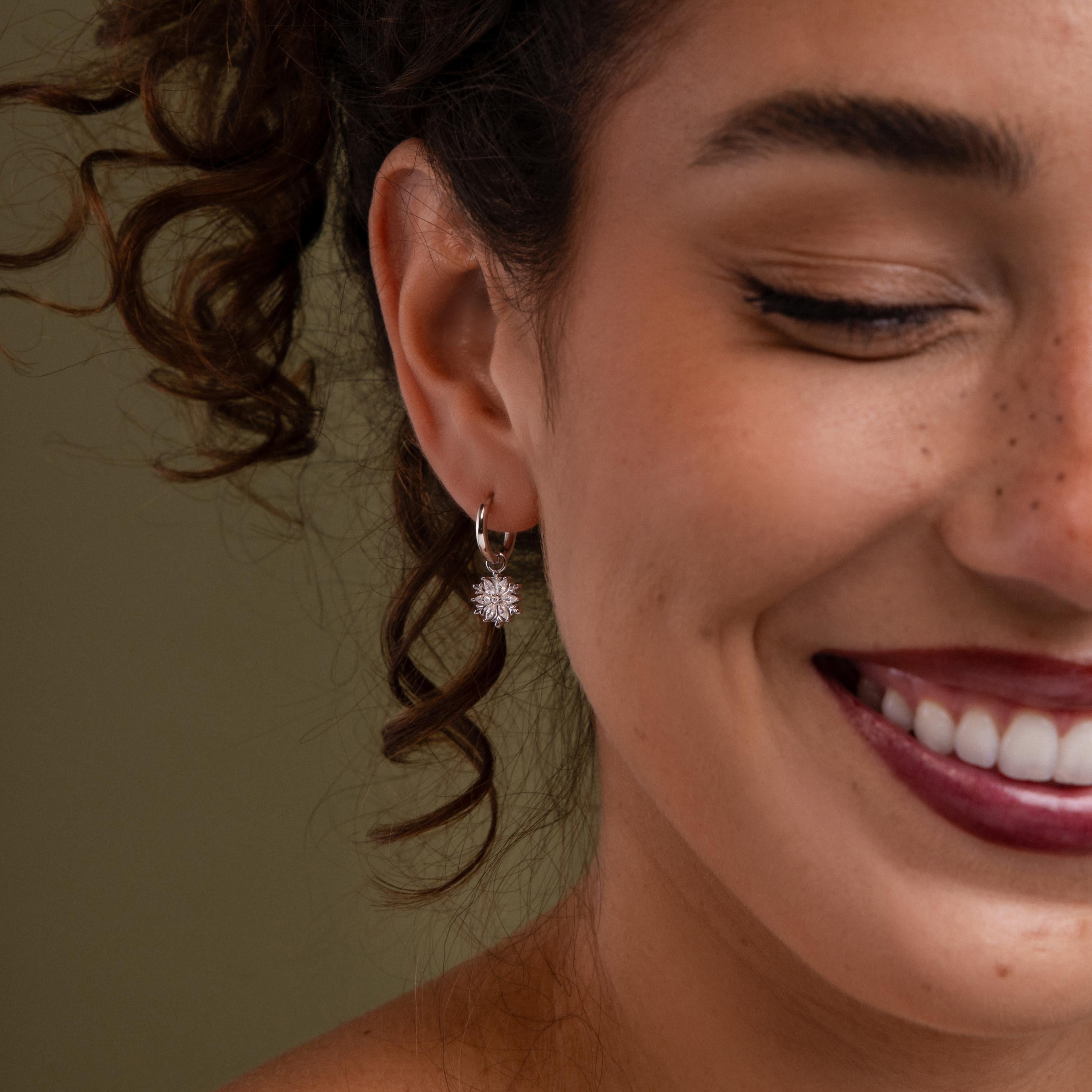 Model wearing our Diamond Poinsettia Hoops in Silver