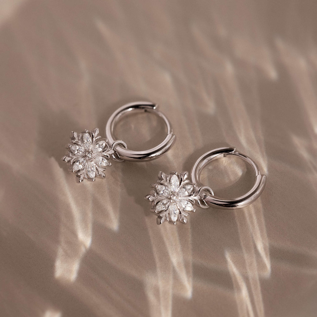 Flstlay of our Diamond Poinsettia Hoops in Silver finish
