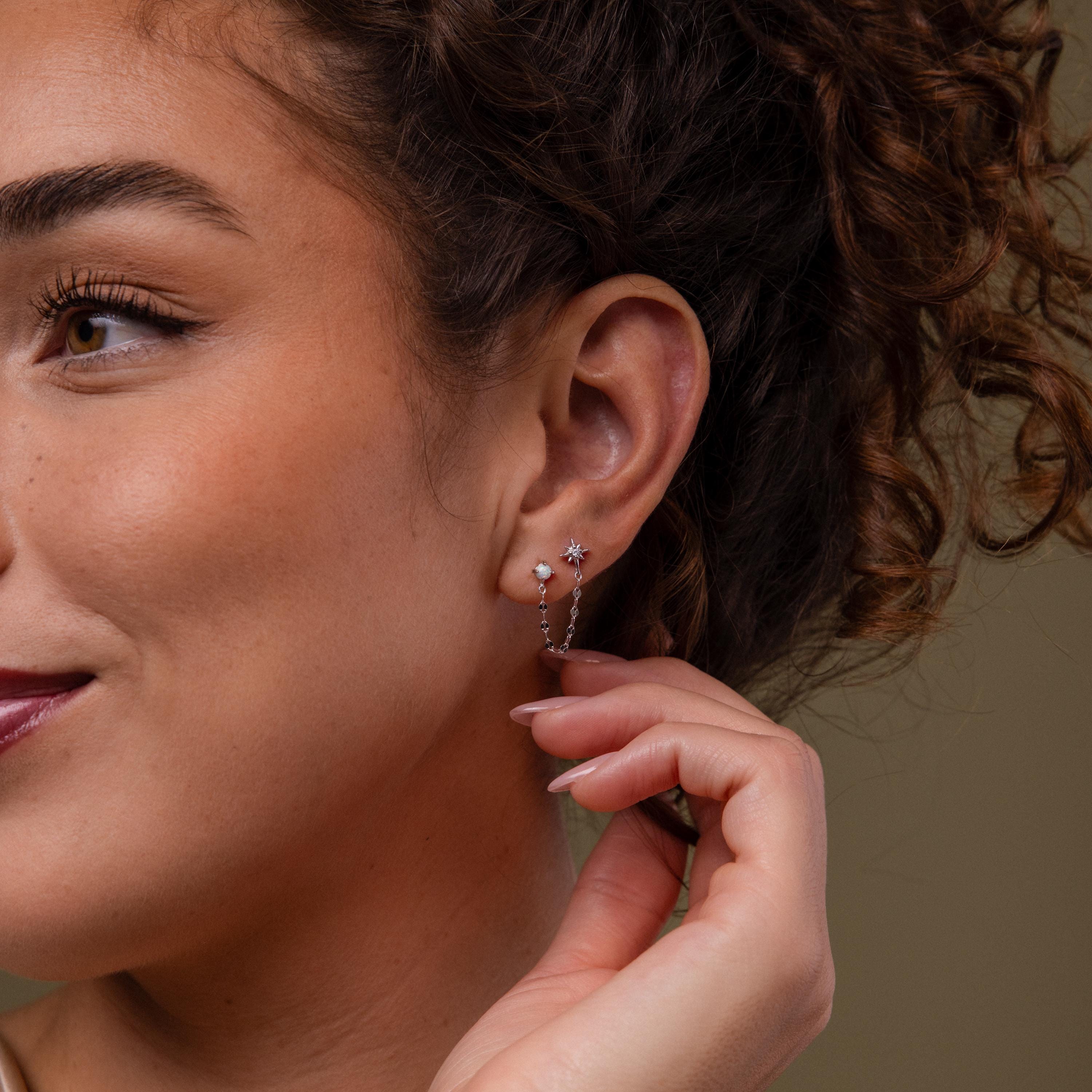 Model wearing our Opal & Star Duo Chain Studs