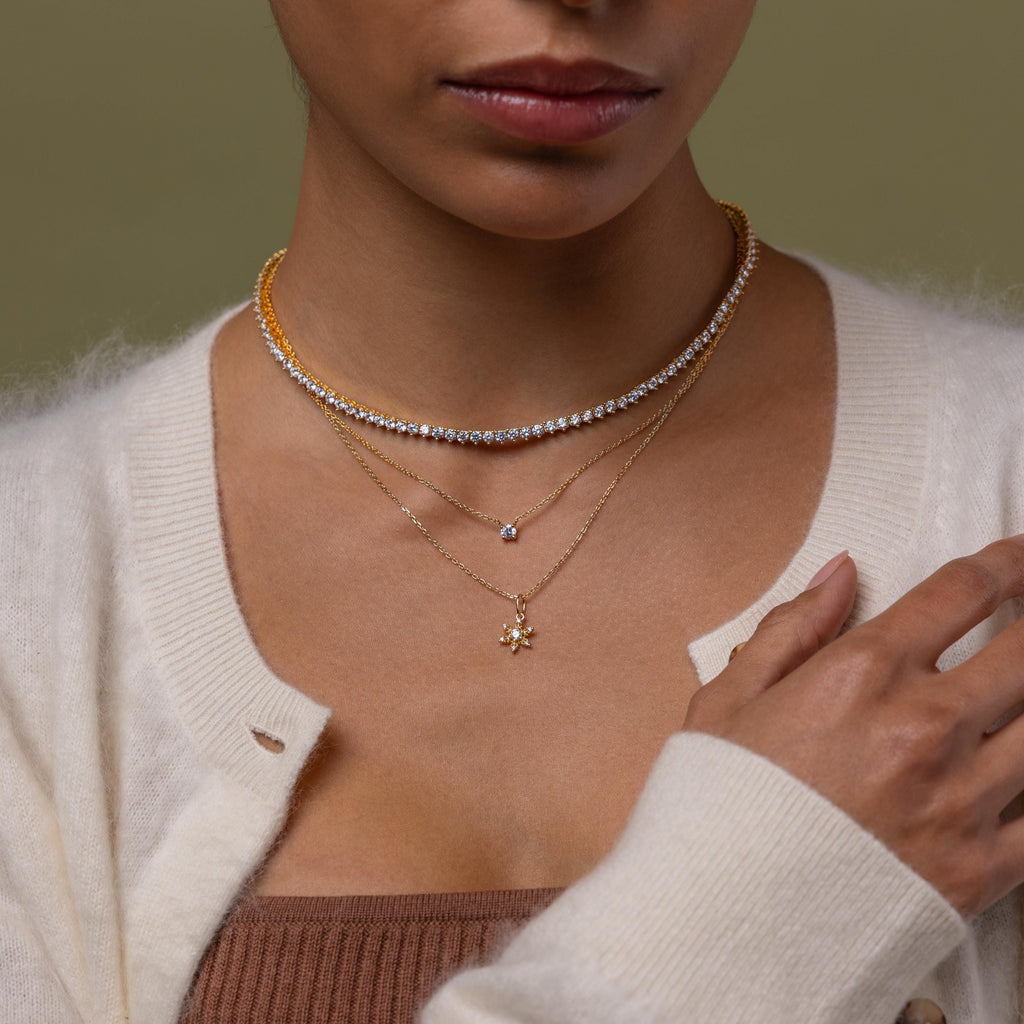 Model wearing our Diamond Snowflake Necklace, styled with our Diamond Choker Tennis Necklace and our Dainty Diamond Necklace