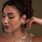 Faraway shot of a model showcasing our Opal & Diamond Chain Studs