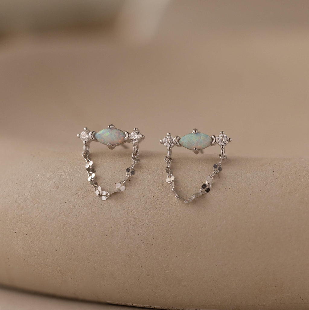 Flatlay of our Opal & Diamond Chain Studs