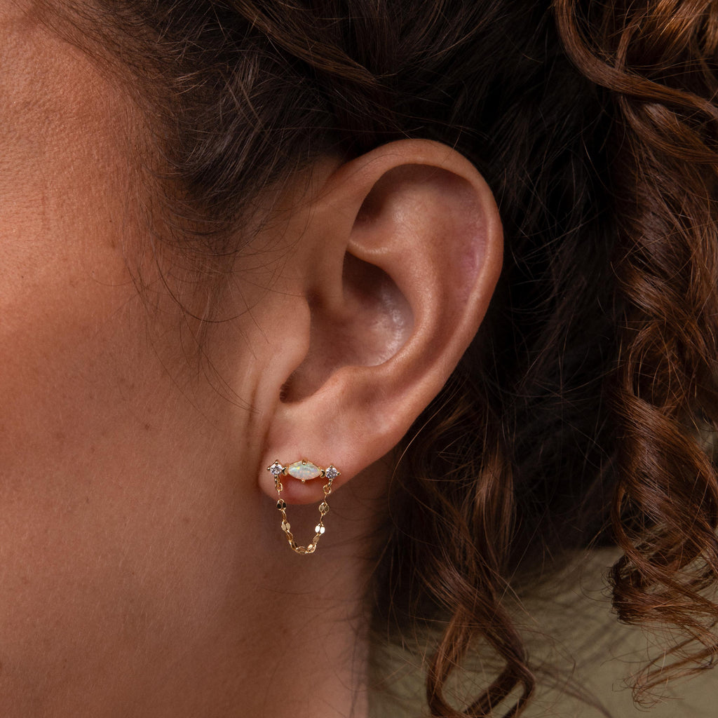 Close up of model wearing our Opal & Diamond Chain Studs