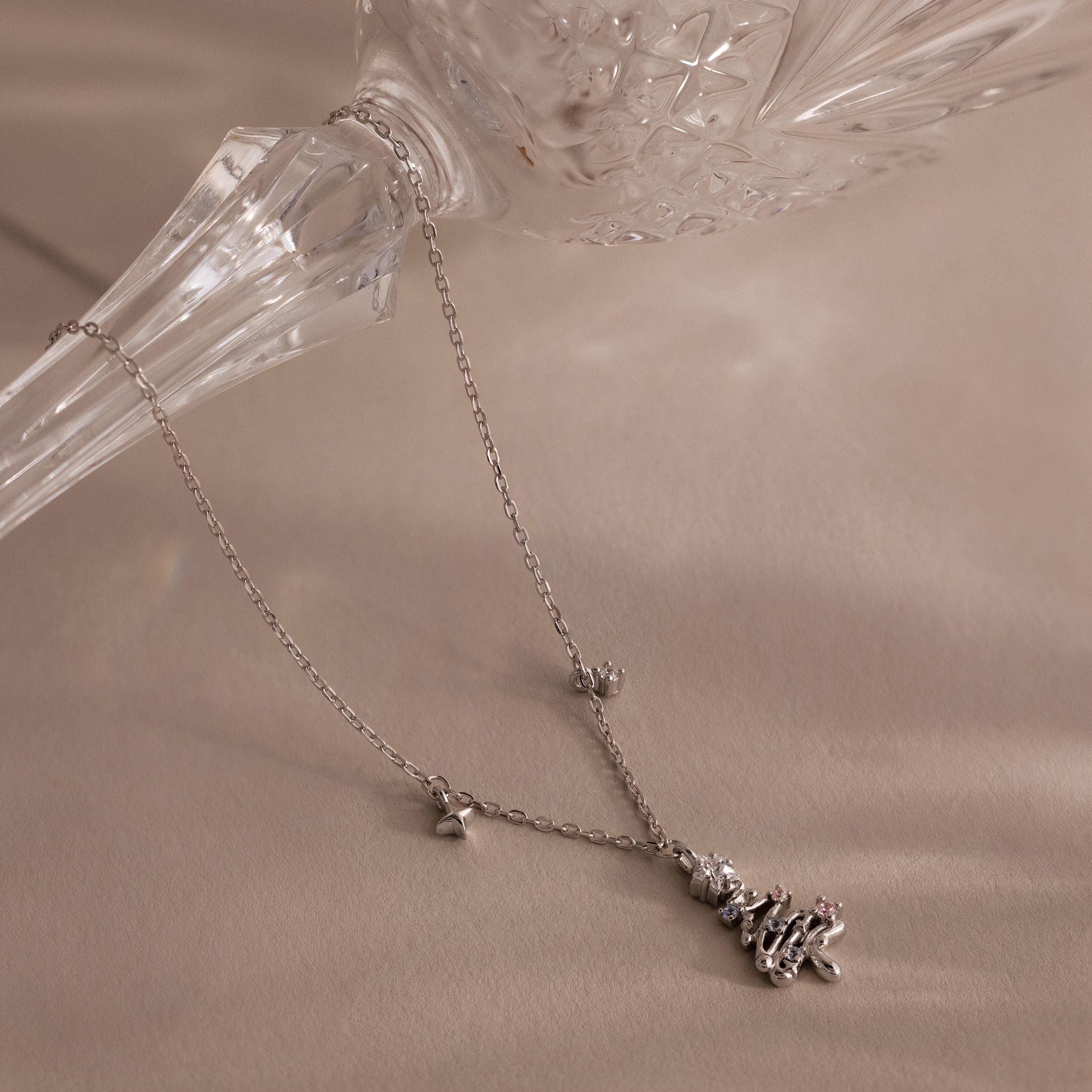 Flatlay of our Holiday Diamond Tree Necklace in Silver