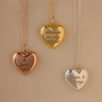 Close up flatlay of our Handwriting Heart Locket Necklaces in Rose Gold, Gold and Silver
