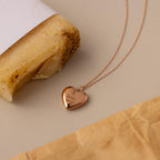 Close up of our Handwriting Heart Locket Necklace in Rose Gold