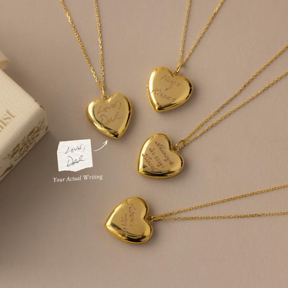 Flatlay of our Handwriting Heart Locket Necklace in Gold with a reference photo of the original handwriting 