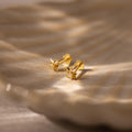 Close up of our Starlight Flatback Studs in Gold