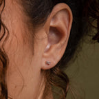 Model wearing our Tiny Bow Flatback Studs in Sterling Silver