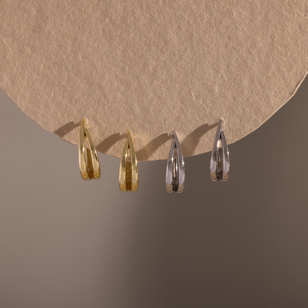 Flatlay of our Oval Duo Hoops in Gold and Silver