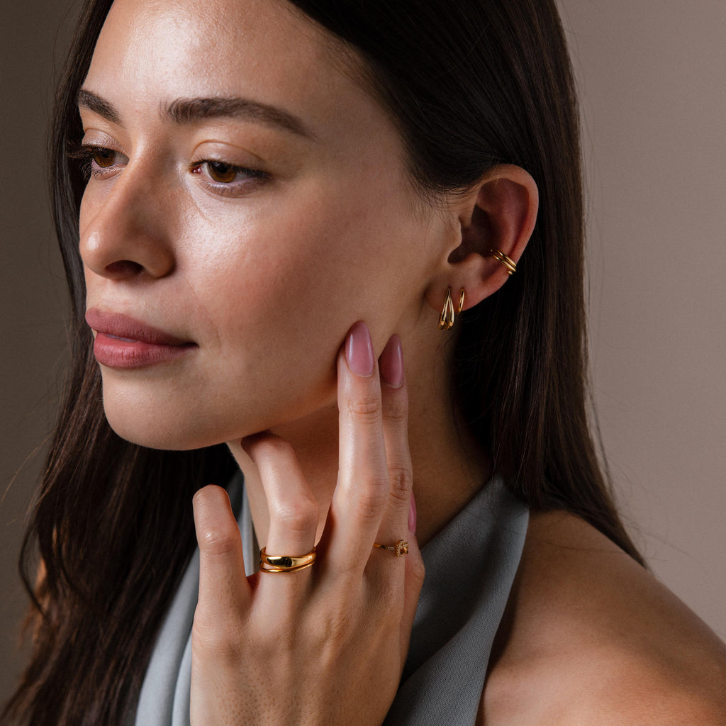 Model showcasing a styled look featuring our Oval Duo Hoops in Gold