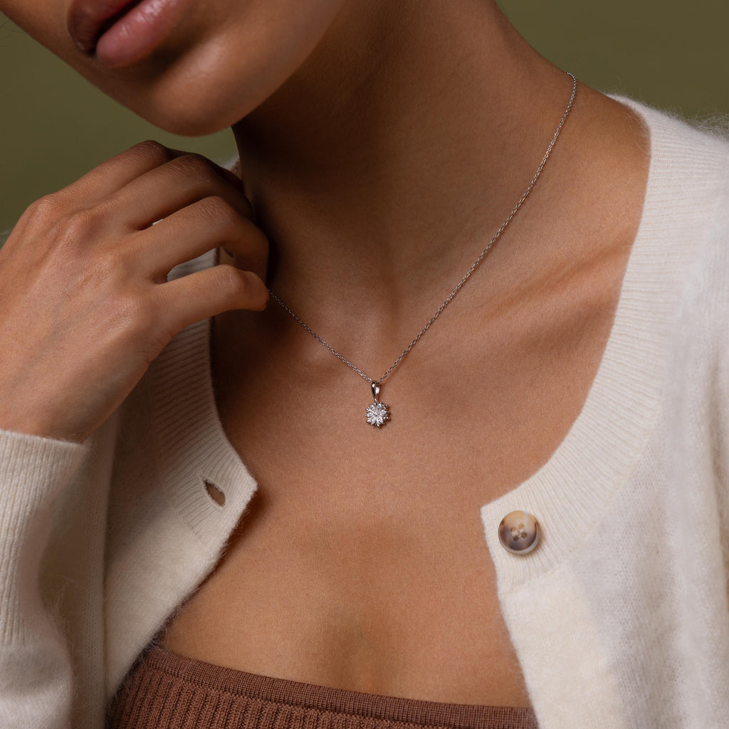 Model wearing our Diamond Poinsettia Necklace in Silver
