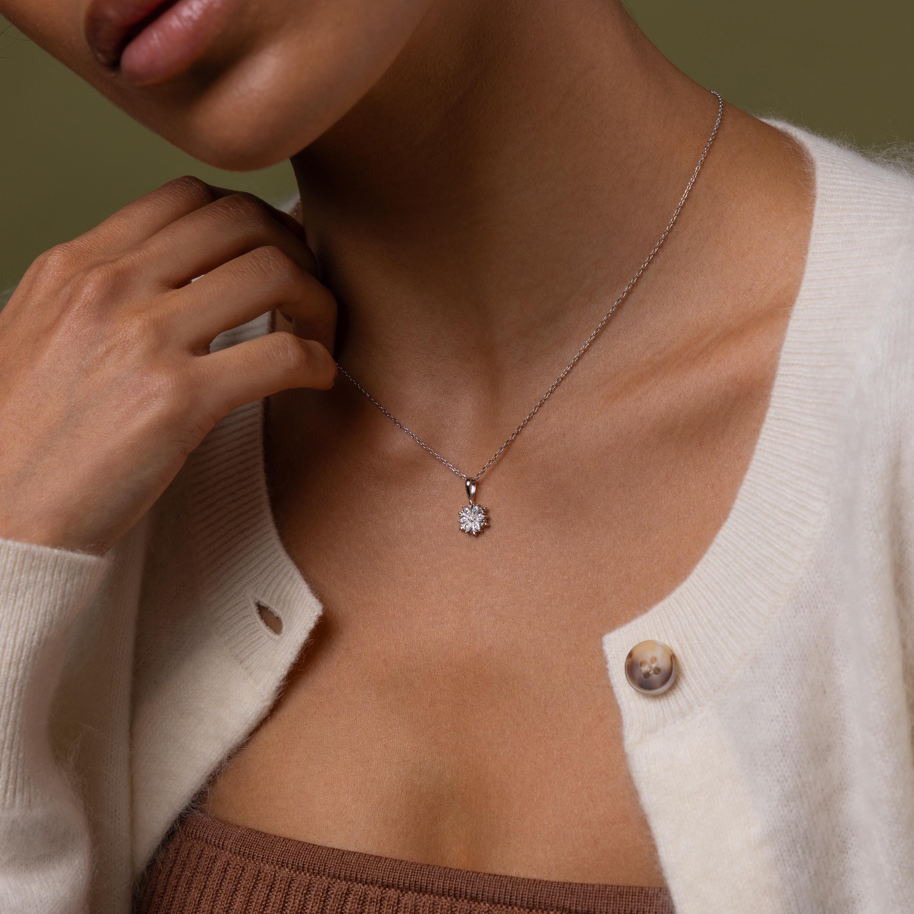 Model wearing our Diamond Poinsettia Necklace in Silver