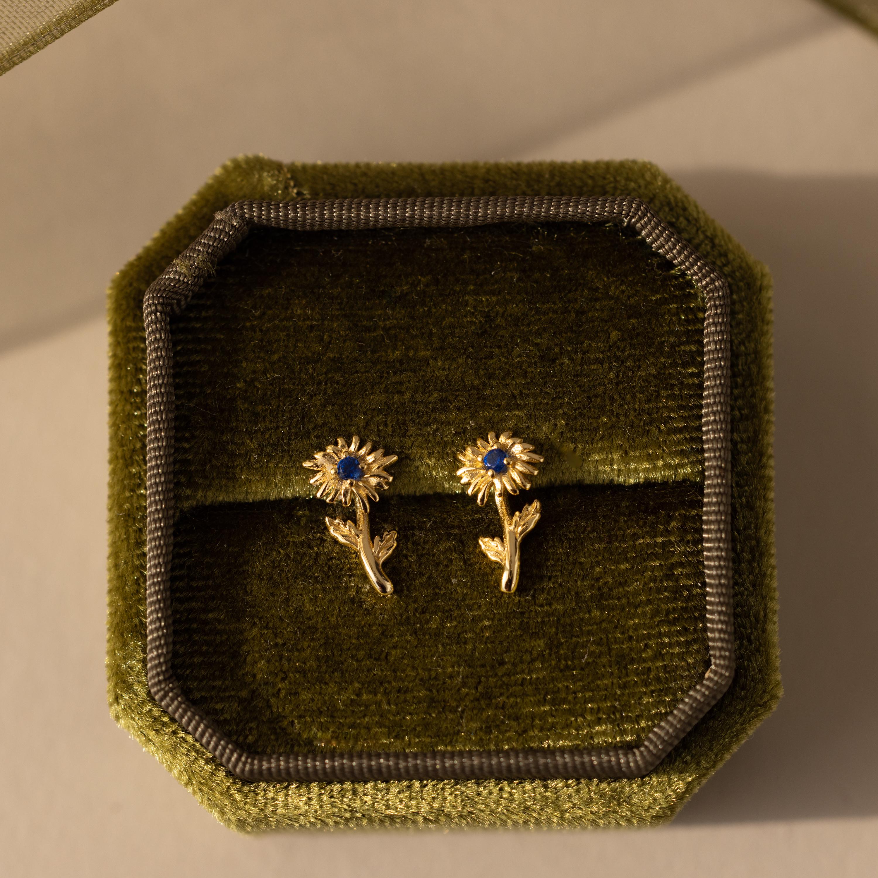 Birth Flower Stud Earrings with Zircon stones in a green velvet box.