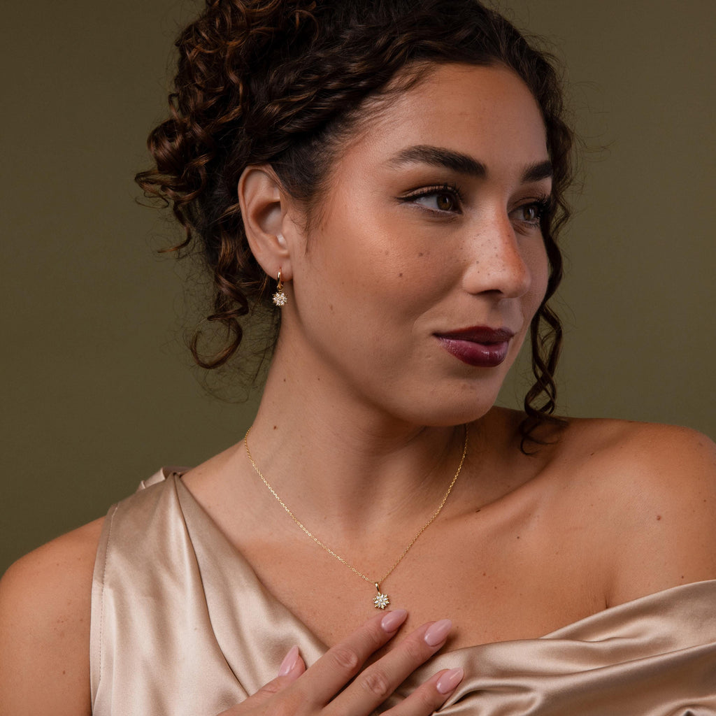 Model wearing our Diamond Poinsettia Hoops & Necklace Jewelry Set