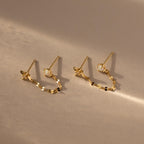 Flatlay of our Opal & Star Duo Chain Studs in Gold