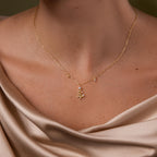 Close up of model wearing our Holiday Diamond Tree Necklace