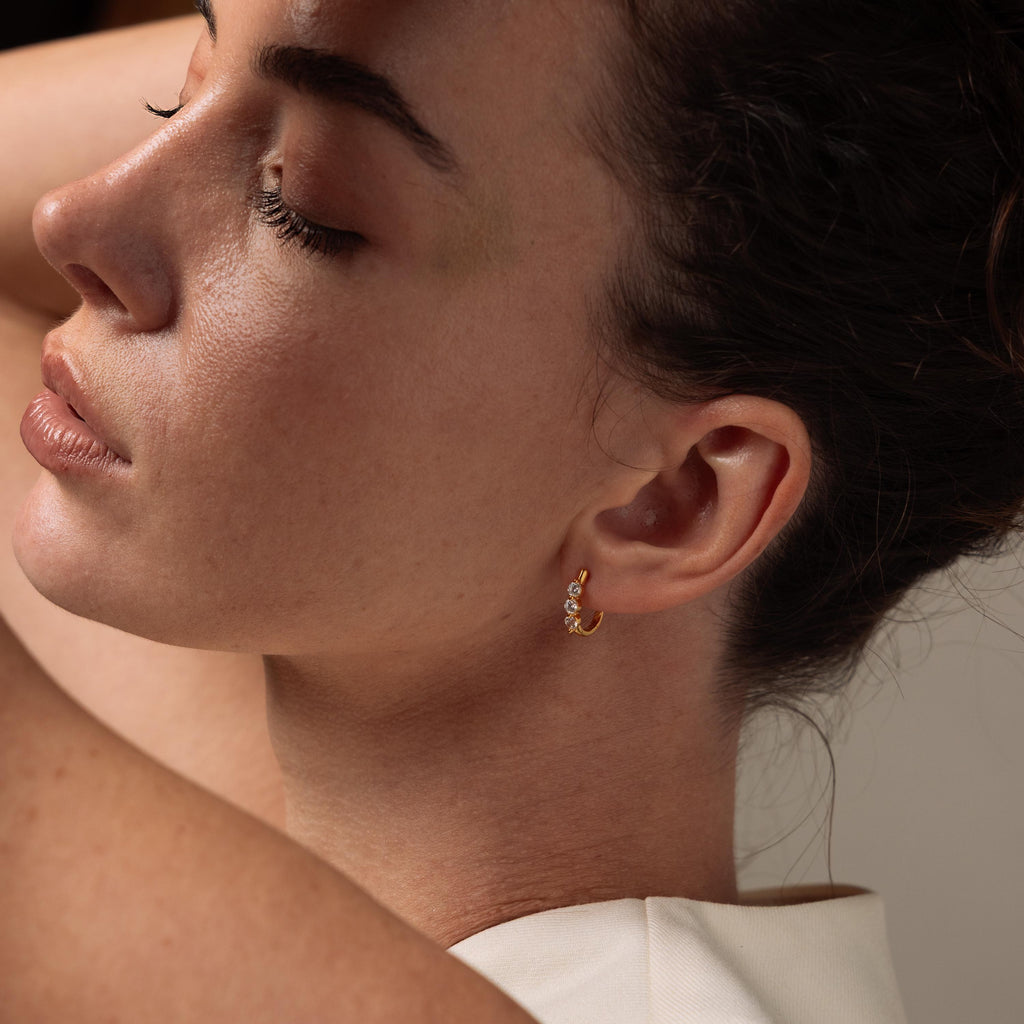 Photo of model wearing our Lace Diamond Hoops in 18K Gold