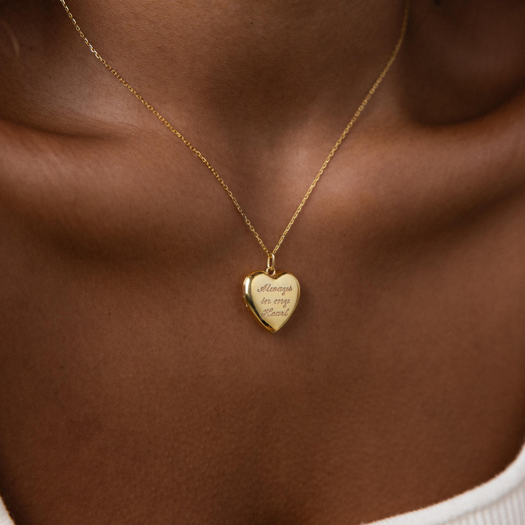 Model wearing our Engraved Heart Locket Necklace in 18K Gold
