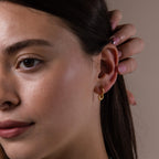 Model wearing our Tiny Teardrop Huggies in Gold