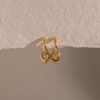 Close up flatlay of our Tiny Teardrop Huggies in Gold