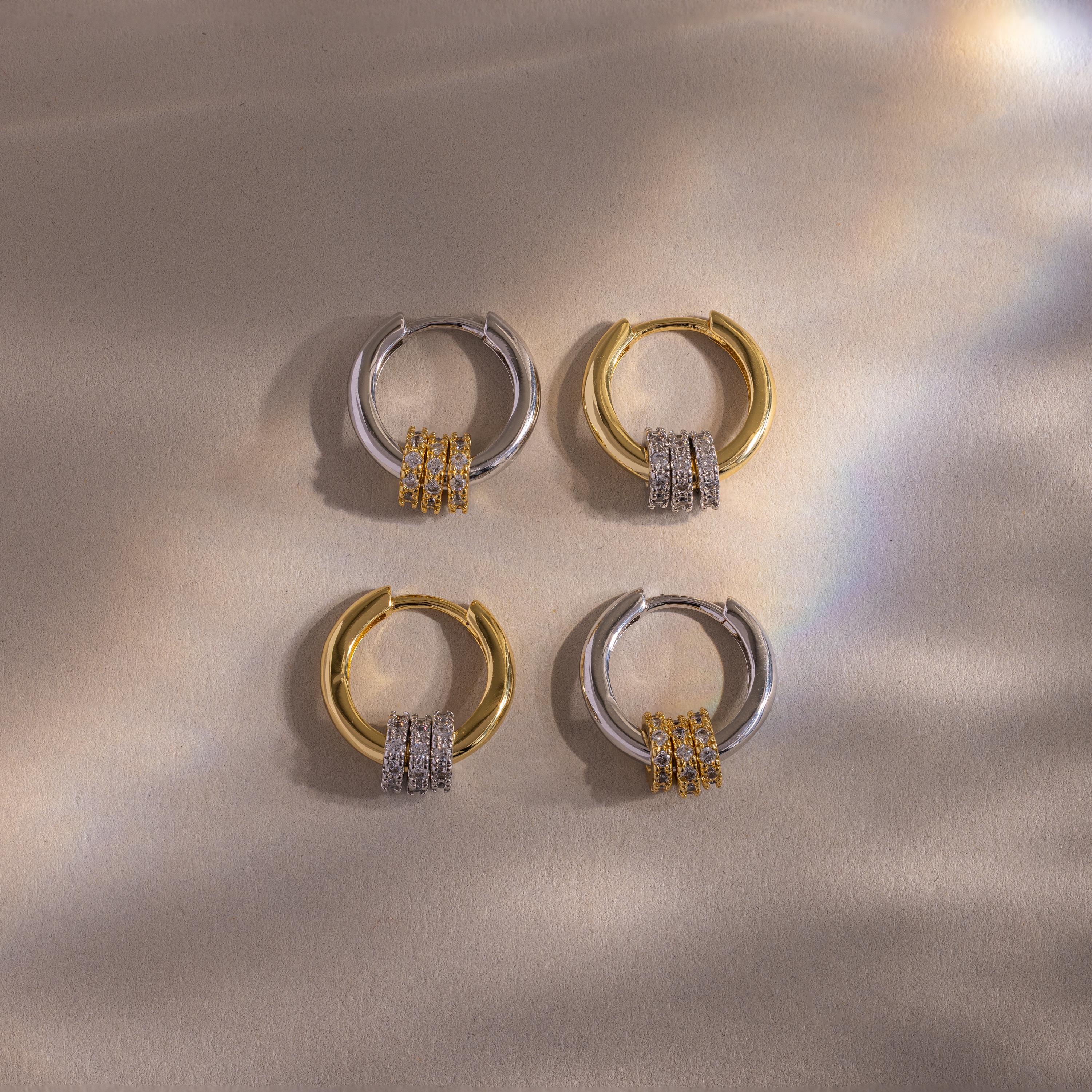 Flatlay of 2 pairs of our Mixed Metal Pave Hoops in Gold and White Gold