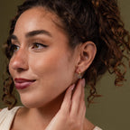 Model wearing our Mixed Metal Pave Hoops in 18K Gold