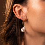 Close-up of a woman’s ear adorned with Statement Pearl Hoops in 18K Gold, showcasing quiet luxury in every detail.