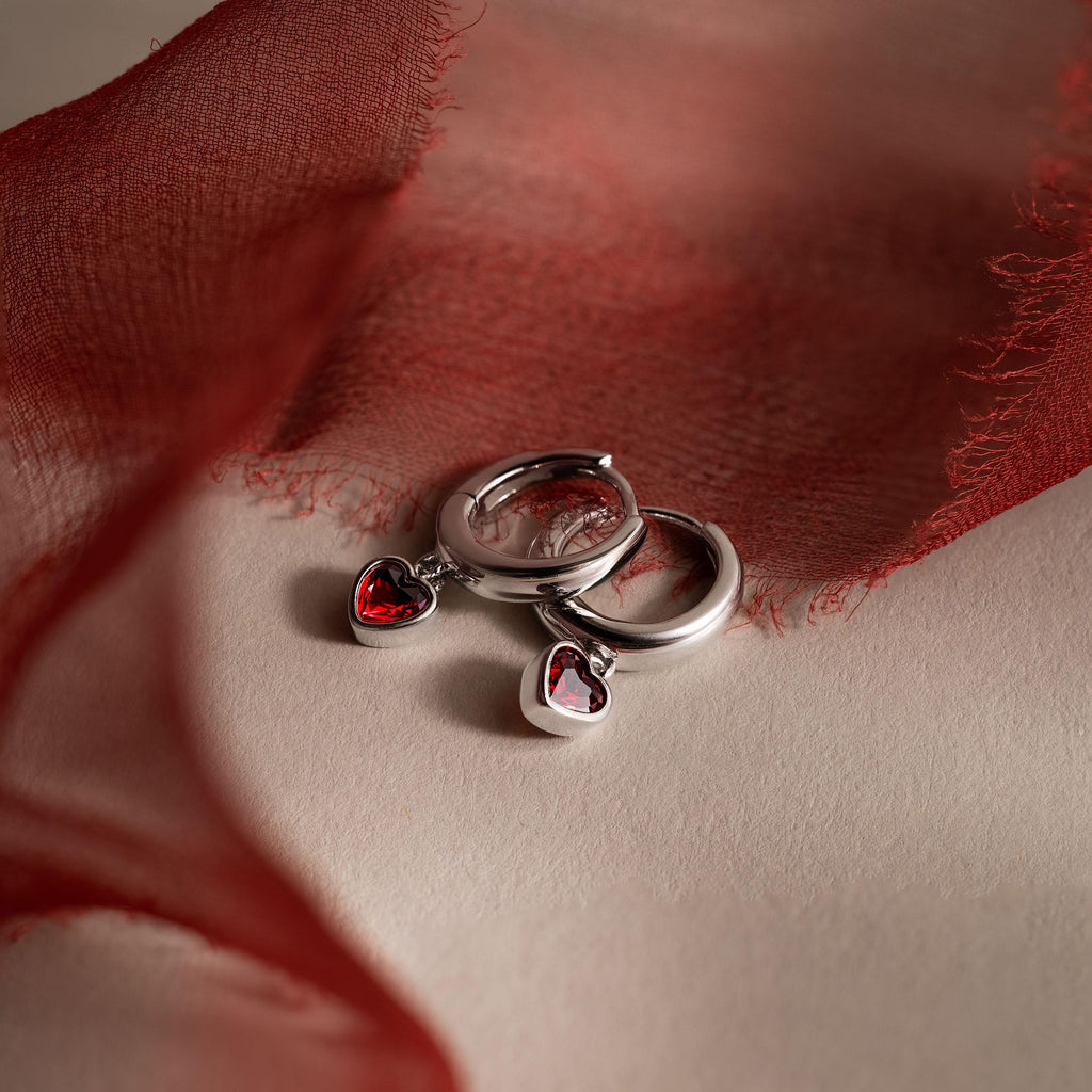 Dangling Garnet Heart Huggies in Silver