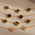 Gemstone Clover Letter Necklaces feature clover-shaped pendants, each with a single letter—L, E, A, T, H, Y, M, D—crafted in radiant 925 sterling silver and arranged on a neutral surface.