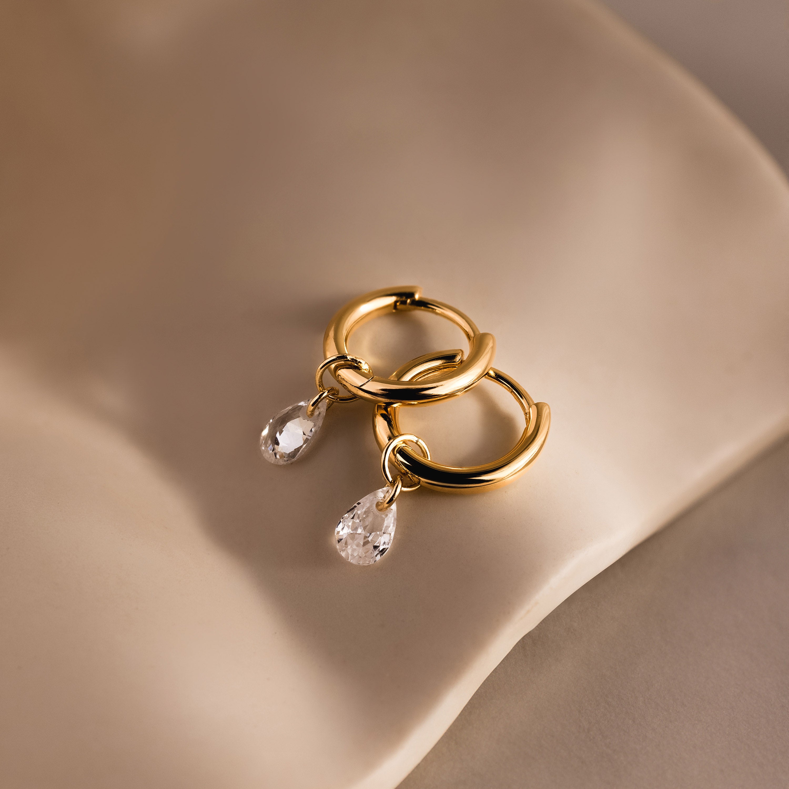Diamond Raindrop Huggies in 18K Gold
