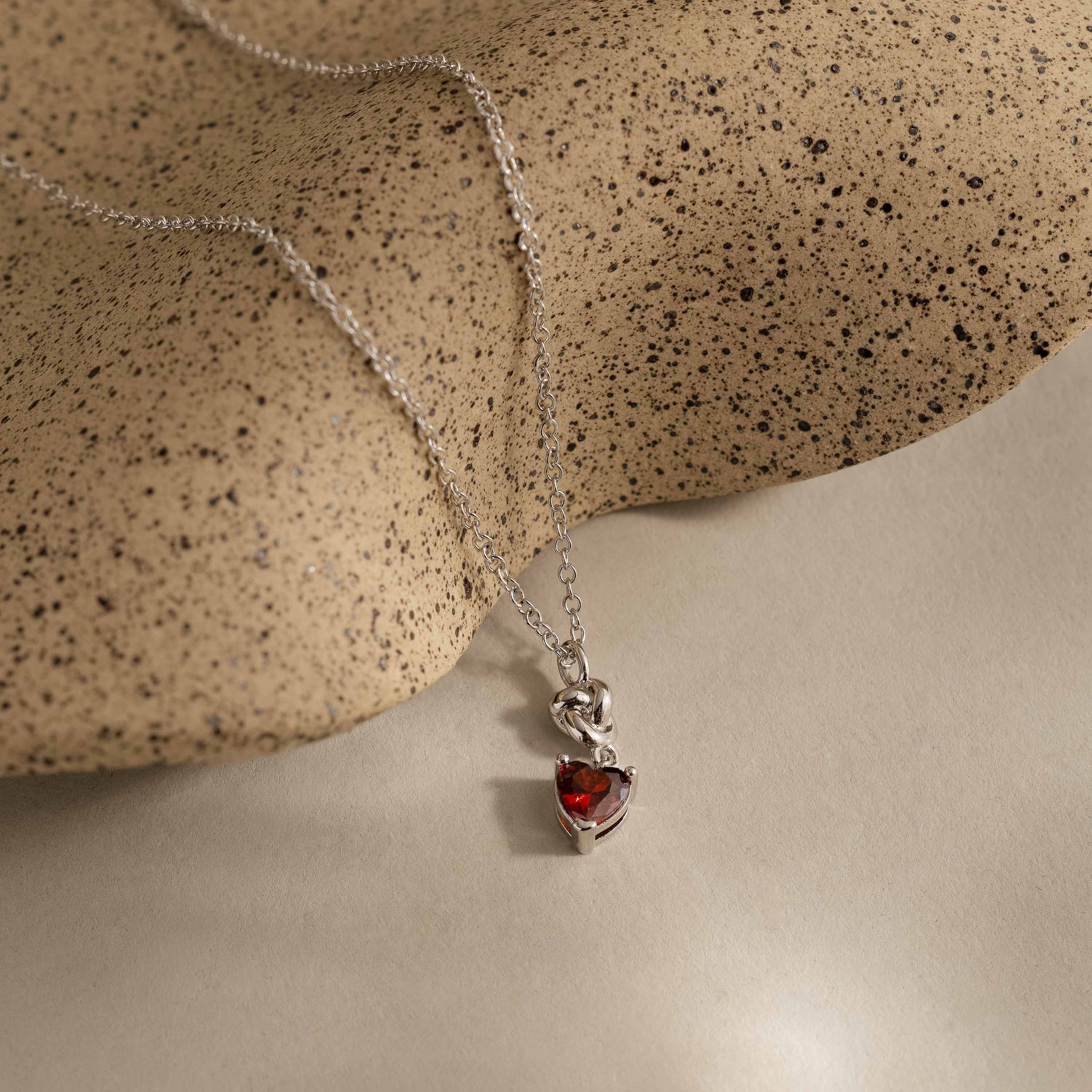 Garnet Heart Knot Necklace in Silver