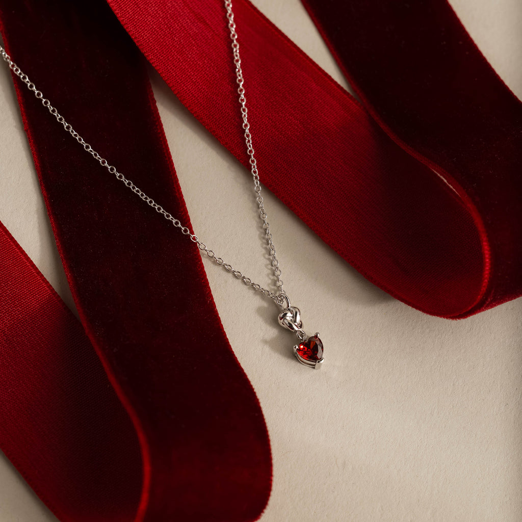 Garnet Heart Knot Necklace in Silver