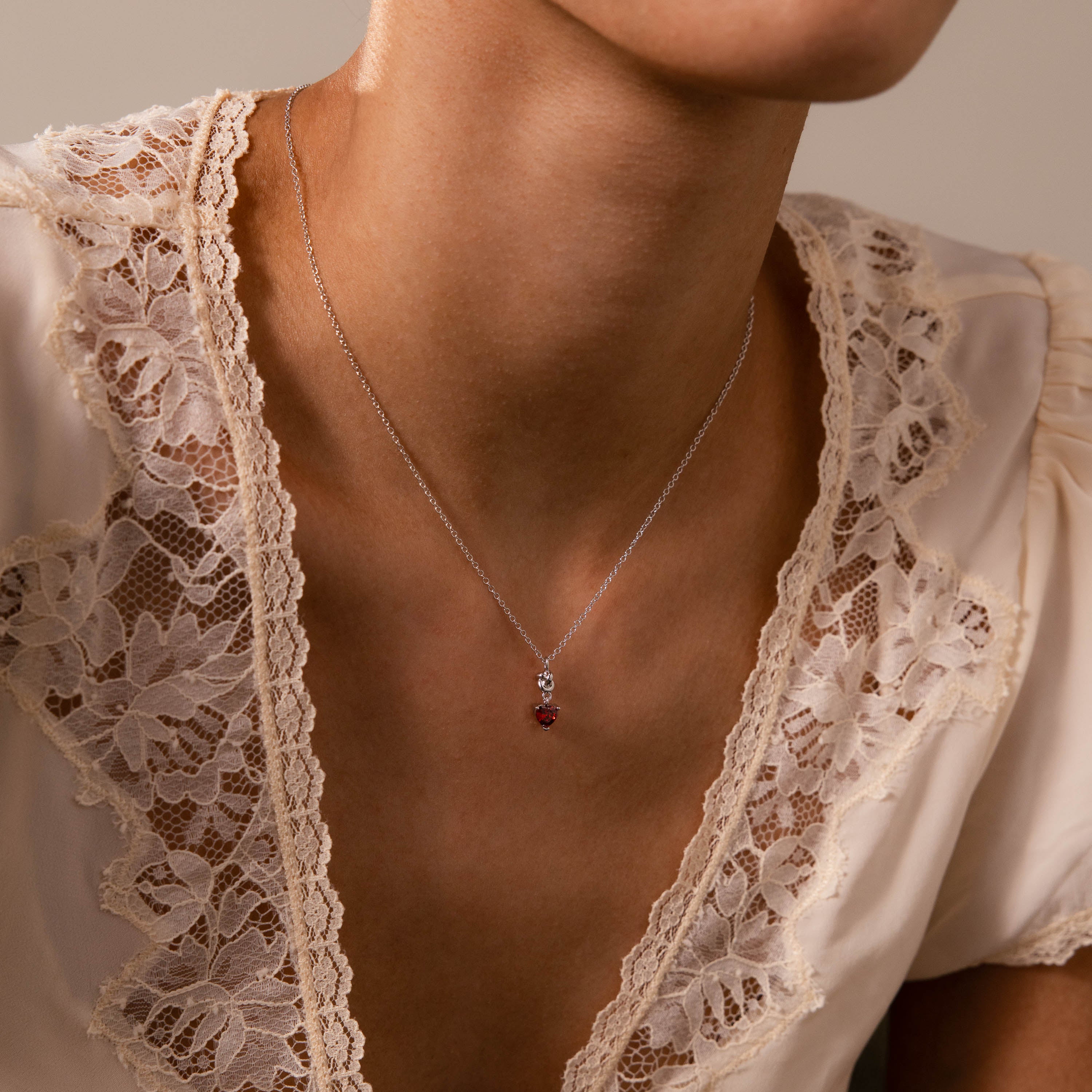 Garnet Heart Knot Necklace in Silver
