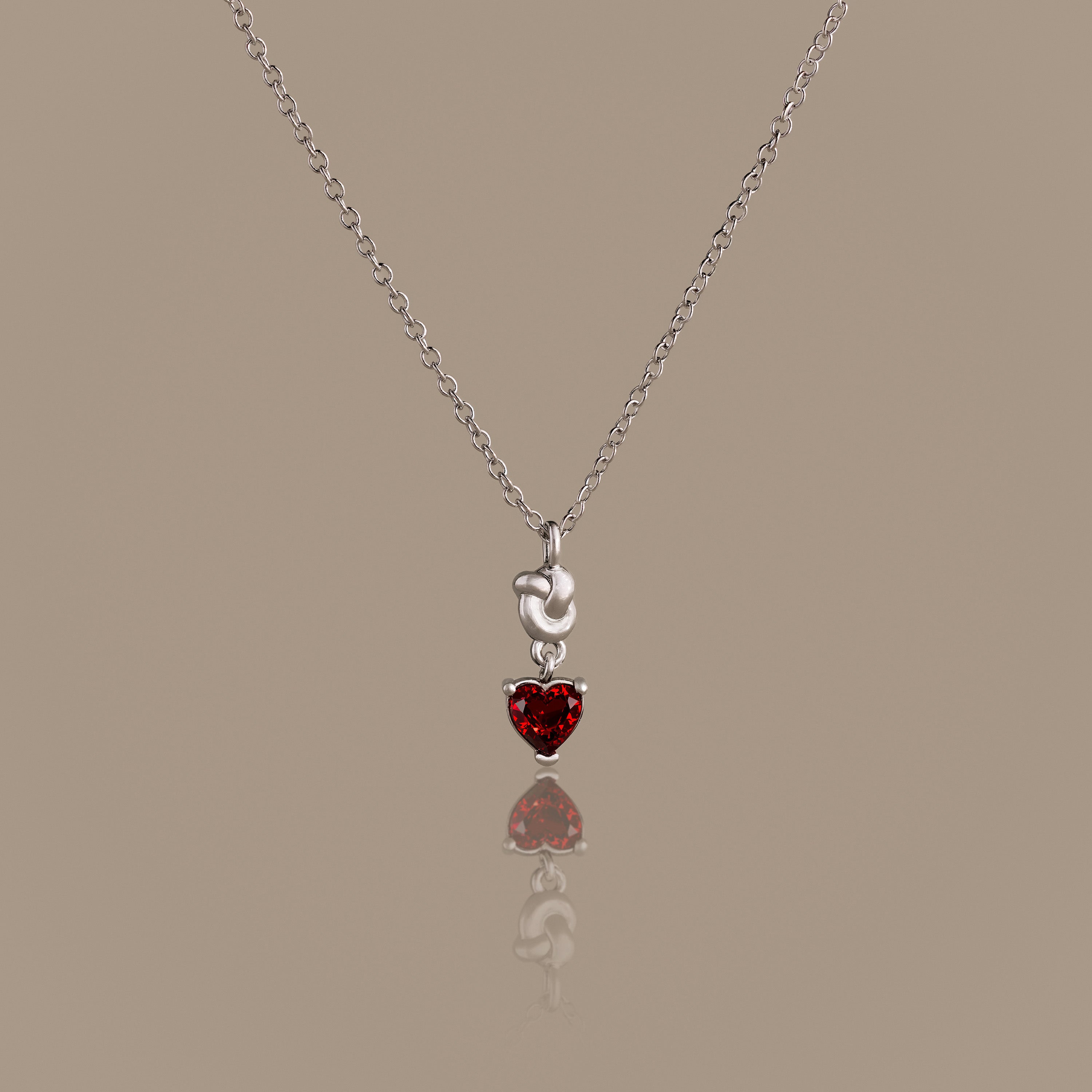 Garnet Heart Knot Necklace in Silver