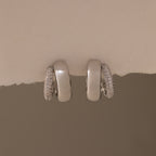 The Duo Pave Dome Studs in White Gold feature one plain and one pavé-encrusted earring, perfect for adding a subtle sparkle to your everyday jewelry collection.