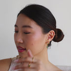 Huggies con incrustaciones de marquesa esmeralda