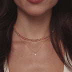 Video of a model wearing our Opal Diamond Necklace in Gold, styled with our Opal Bezel Tennis Necklace