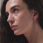 Video of model showcasing our Lace Diamond Hoops in 18K Gold