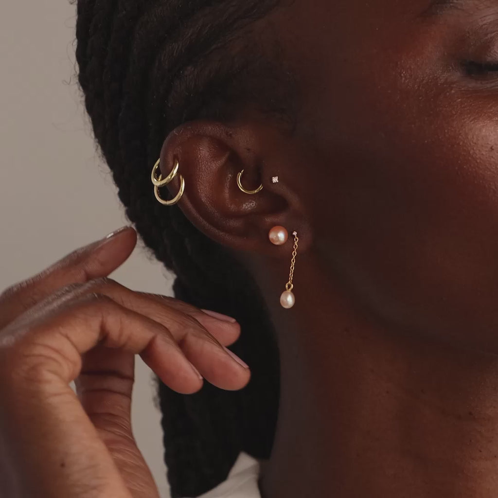 Clous d'oreilles en perles roses en or 18 carats