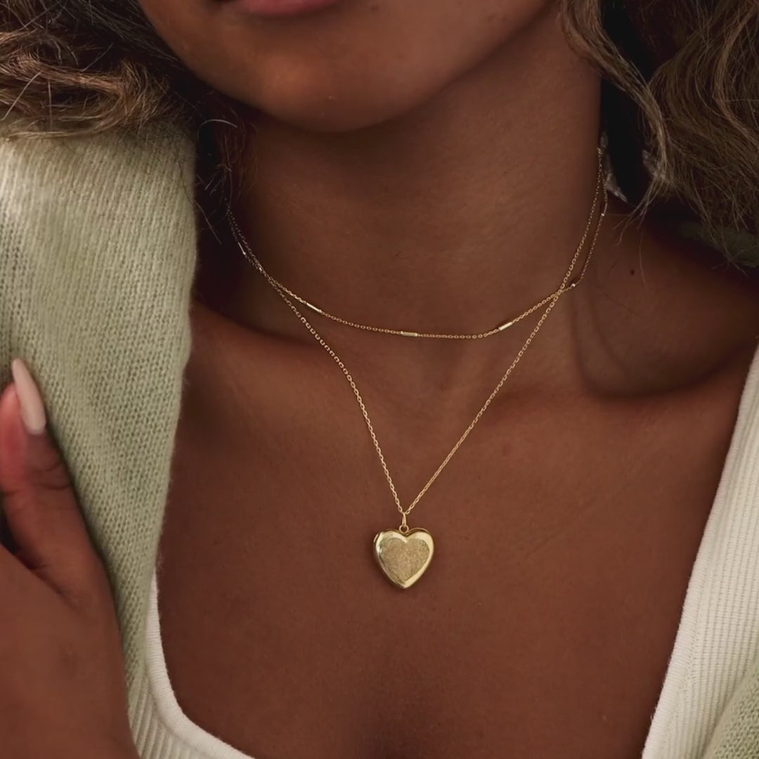 Video of model wearing our Fingerprint Heart Locket Necklace in Gold
