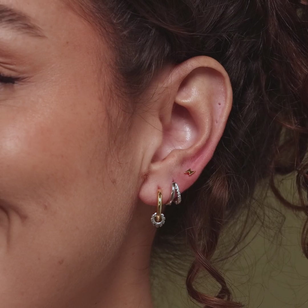 Video of a model wearing our Mixed Metal Pave Hoops in 18K Gold