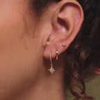 Video of our model showcasing our Starlight Flatback Studs, styled with our Editor Huggies and Moon and Star Huggies