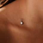 The Opal Sea Turtle Charm in Silver necklace elegantly rests on the neck and collarbone, capturing the essence of ocean-inspired jewelry.