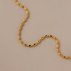 The Oval Beaded Bracelet in 18K Gold features polished beads arranged in a sleek design, making it a perfect choice for fans of modern jewelry.