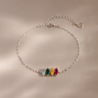 The Multiple Marquise Birthstone Bracelet in Sterling Silver features four colored gemstones and an adjustable chain, beautifully displayed on a neutral background. Perfect customizable jewelry for lovers of elegant birthstone bracelets.