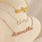 Three Pave Dream Script Name Necklaces personalized with "Evelyn" in gold, "Claire" in silver, and "Samantha" in rose gold—each custom piece adds a unique touch to your style.