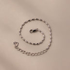 The Oval Beaded Bracelet in Silver features an elegant oval link design and a secure lobster clasp, perfect for adding a modern touch to any look.