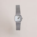Our Luxe Square Timepiece watch in Sterling Silver on a light gray background