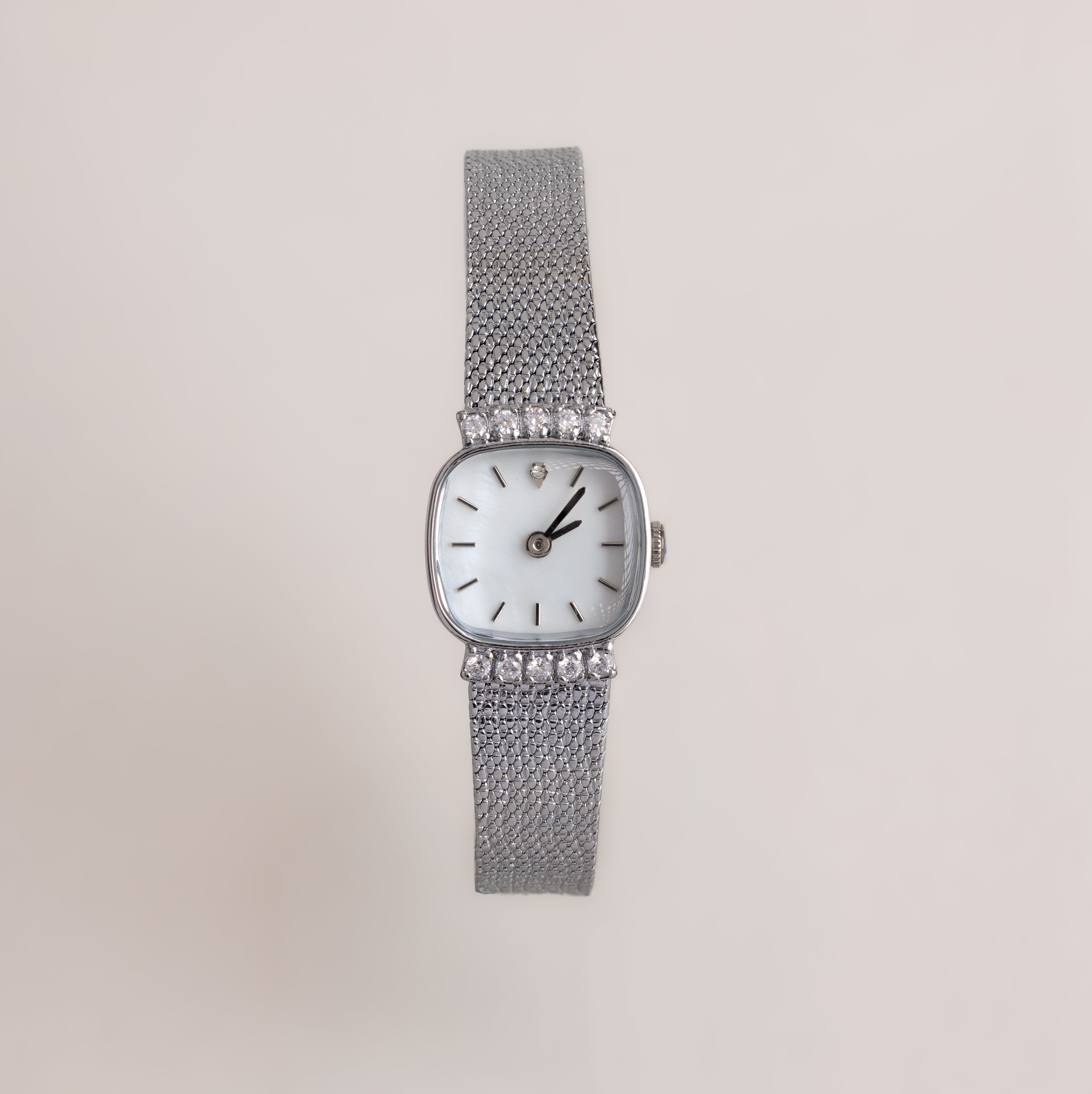 Our Luxe Square Timepiece watch in Sterling Silver on a light gray background